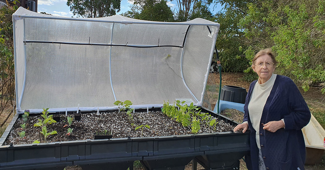 Photo: Janet standing next to her Vegepod