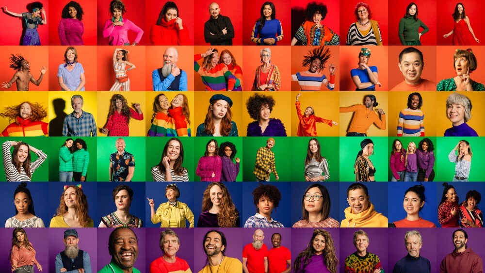 10 x 6 colourful portraits with different people that form a rainbow pride flag 