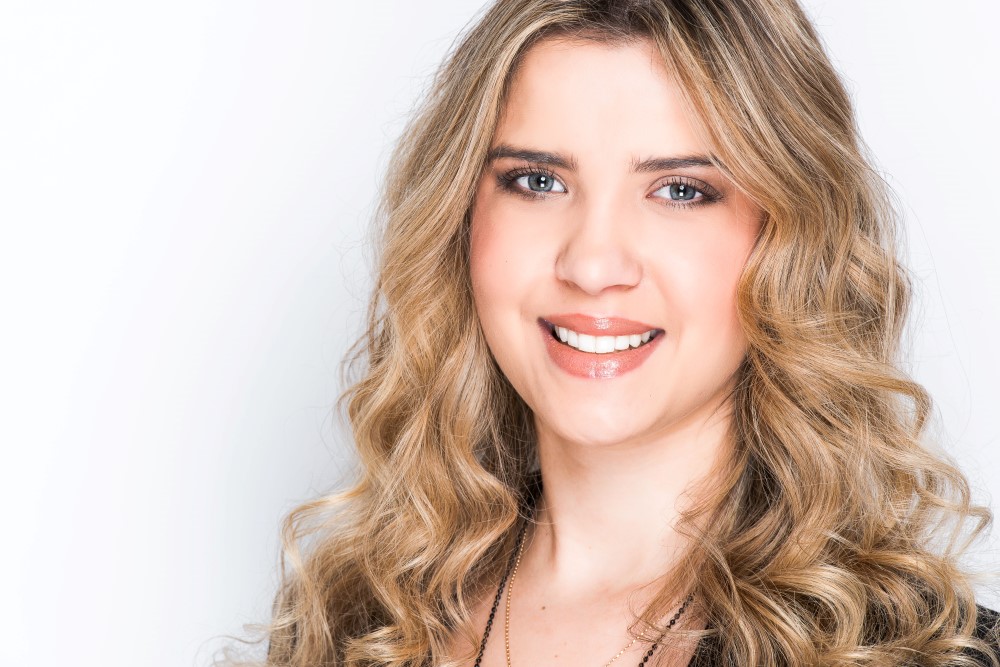 Portrait of young woman with blonde wavy hair