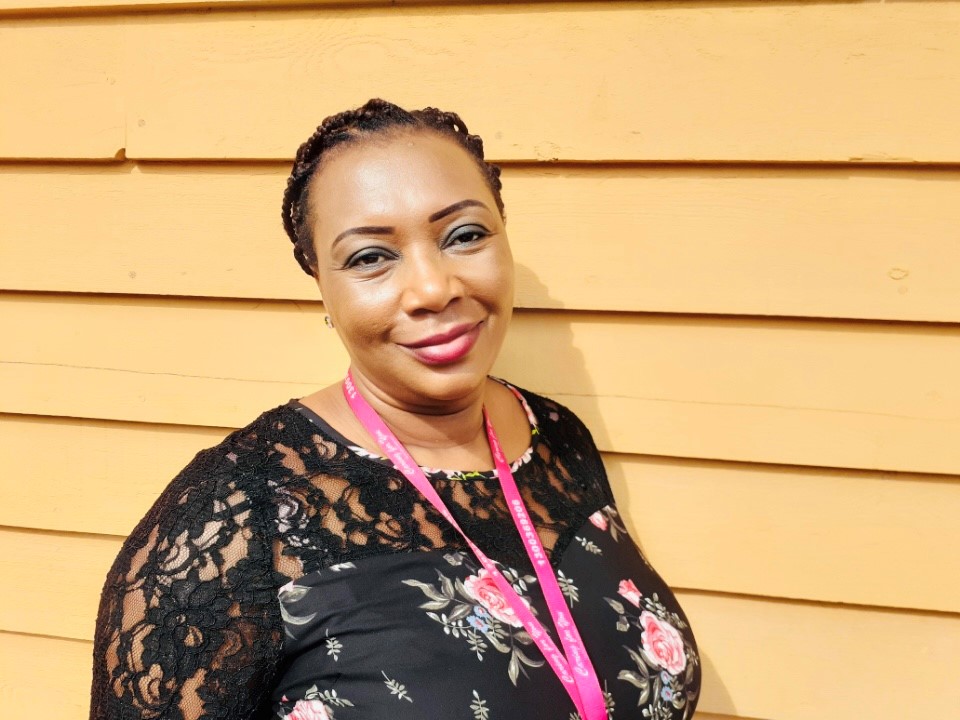 Black woman smiling at camera 