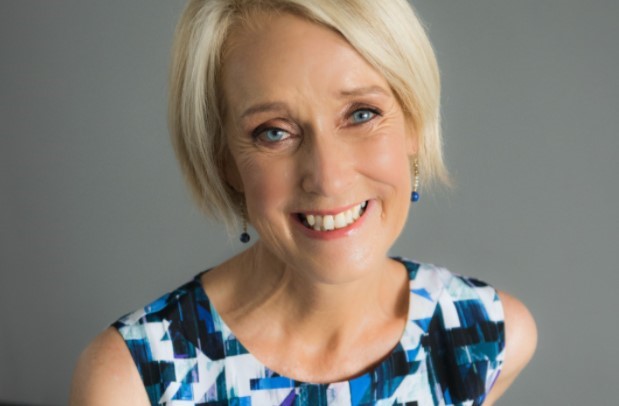 Woman with blonde short hair smiling at camera 