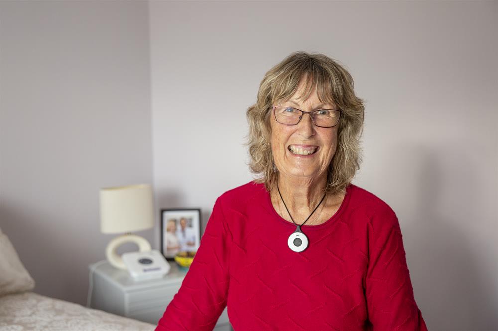 Senior lady with personal alarm pendant Senior lady with personal alarm pendant