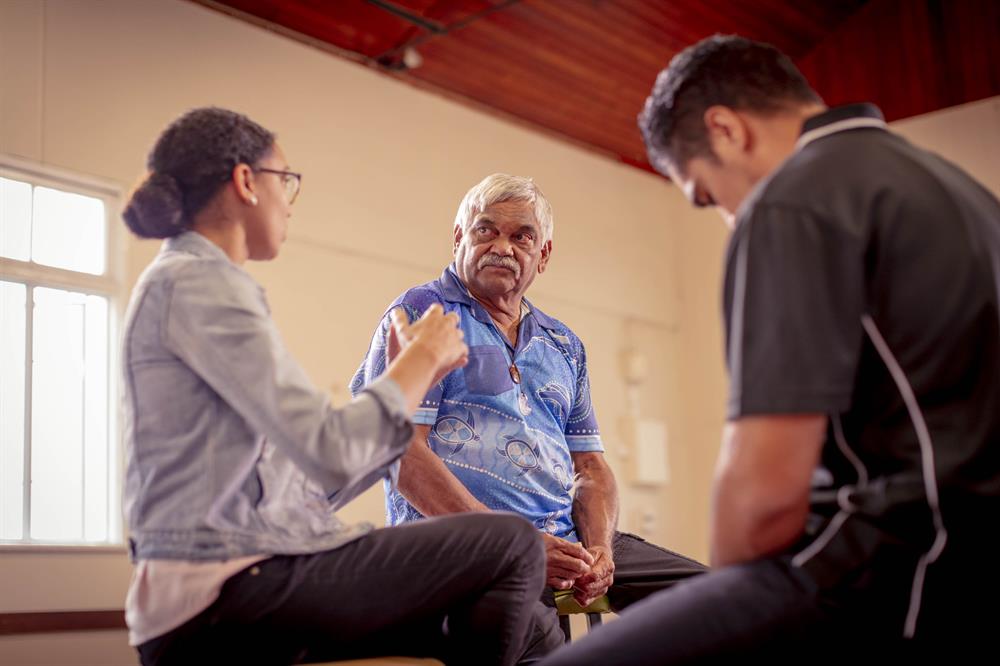 ATSI talking Group of adults talking seriously