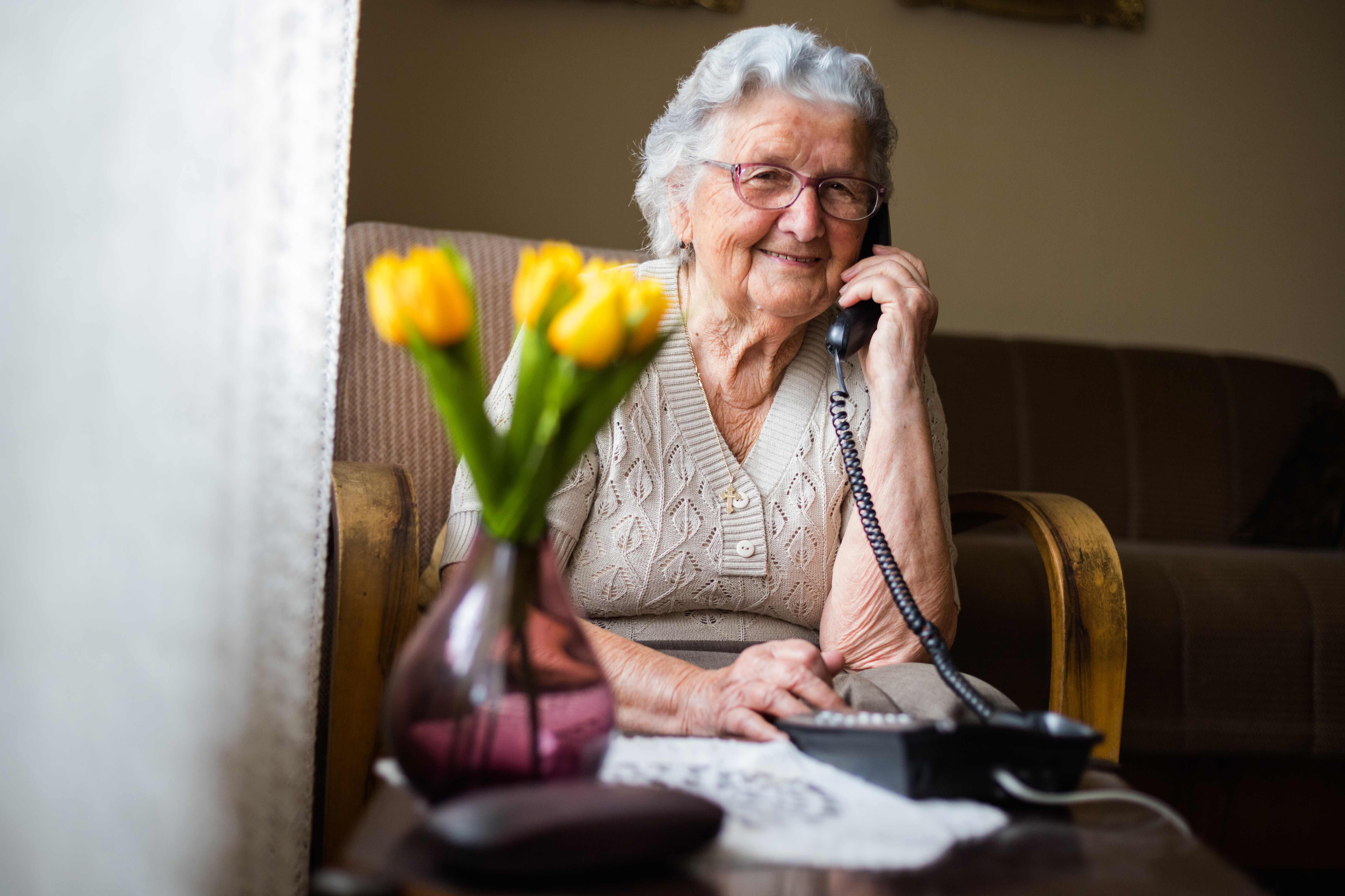 Senior lady sitting in armchair