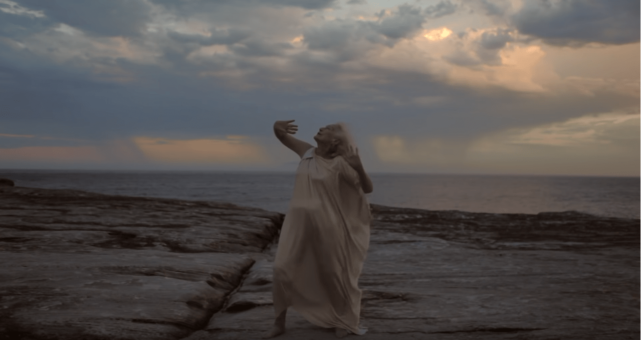 Eileen Kramer dancing on the beach side 