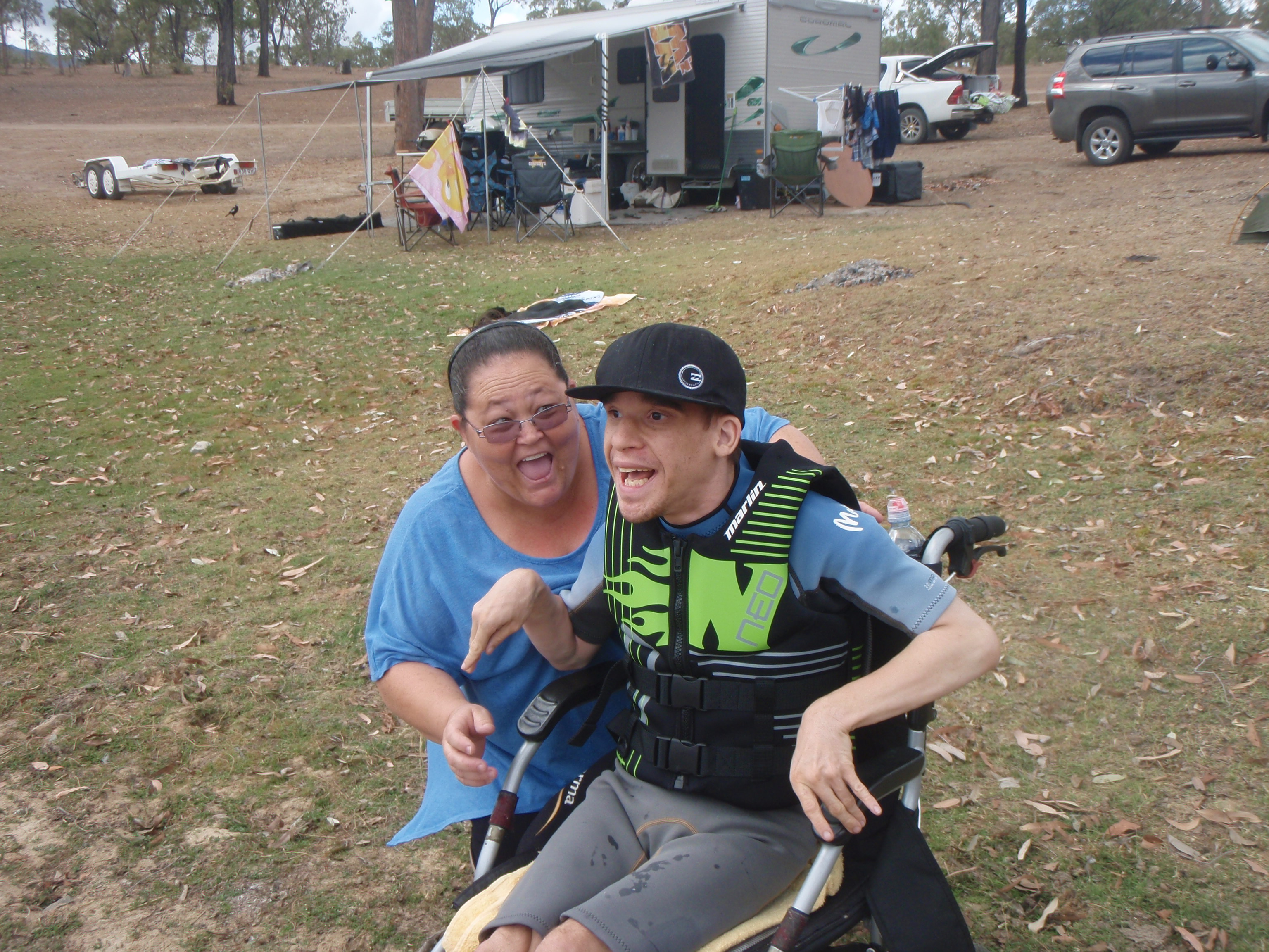 Woman laughing with man in a wheelchair