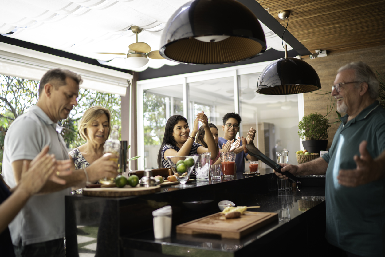 Group of friends gathering around a bbq