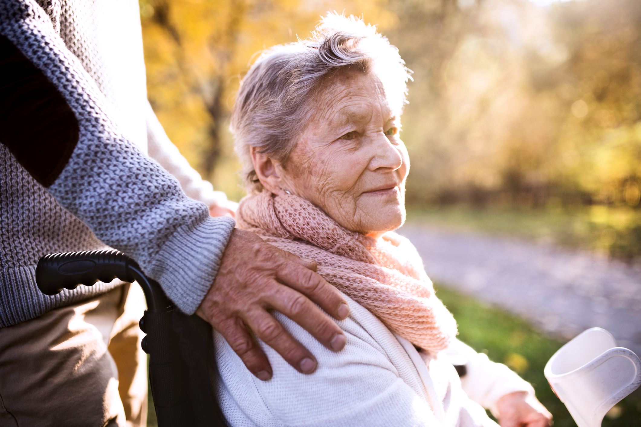 Adult with elderly parent in wheelchair