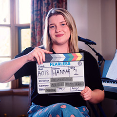 Photo: Hannah Smedley holding Fearless Films clapper board