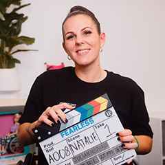 Photo: Natalie Curtis holding Fearless Flims clapper board