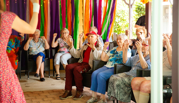 Seniors learning hand gestures to children's song