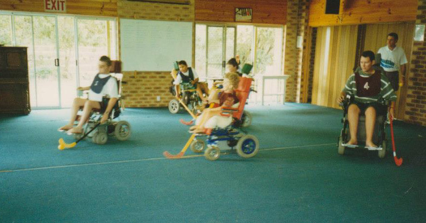 Photo: Young Tristram playing wheelchair hockey