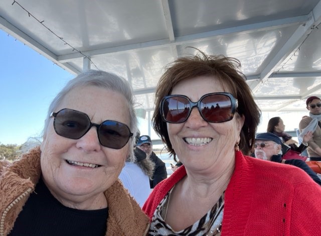 A selfie of two senior ladies on a boat