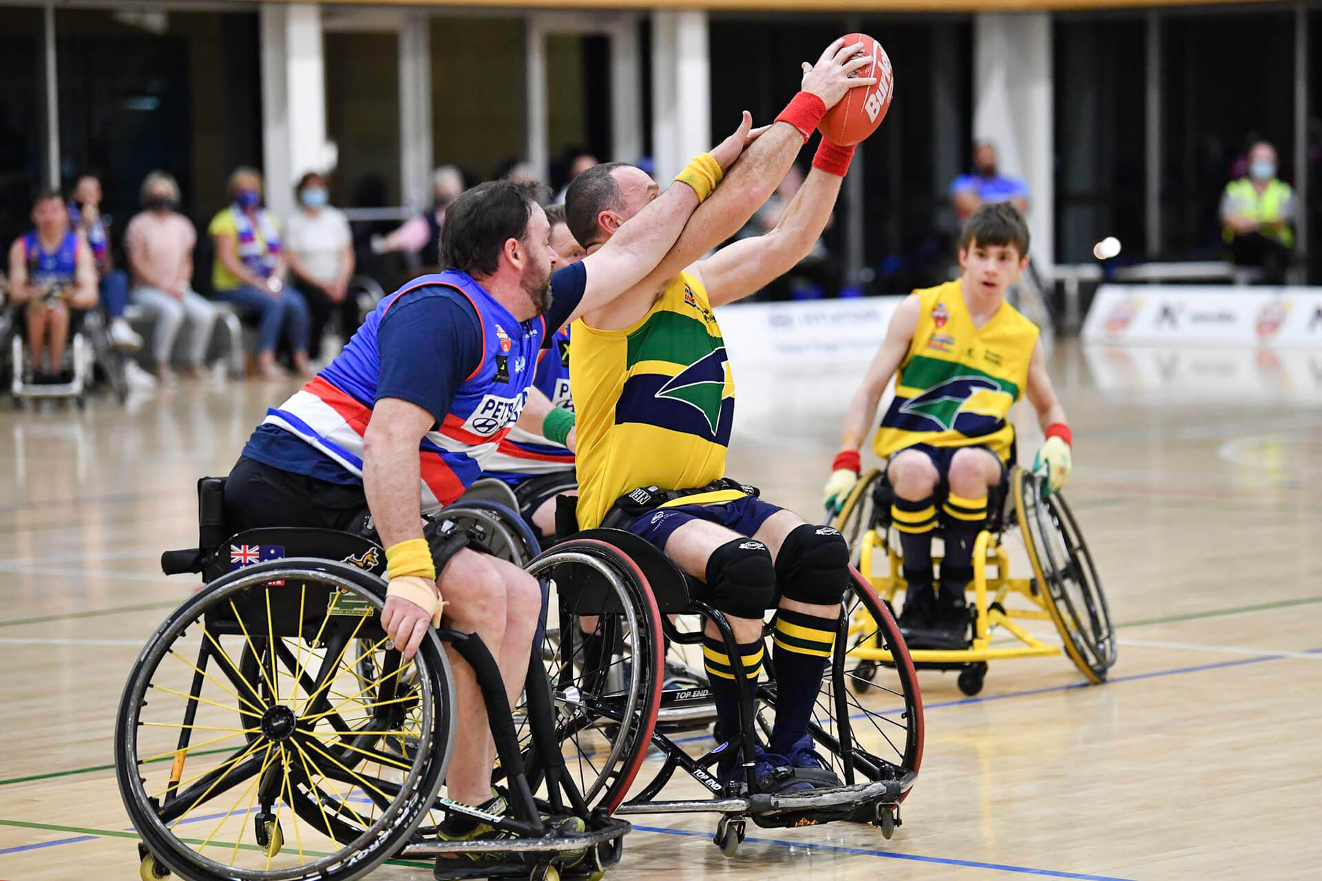 Photo: Men playing wheelchair footy